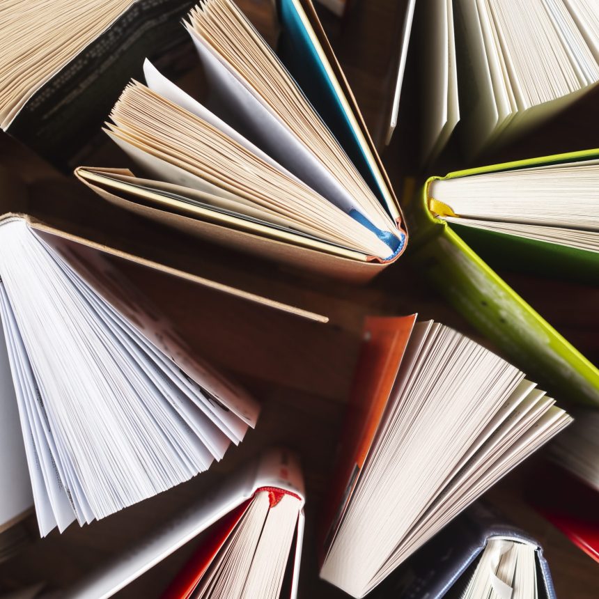 flat-lay-opened-books-table
